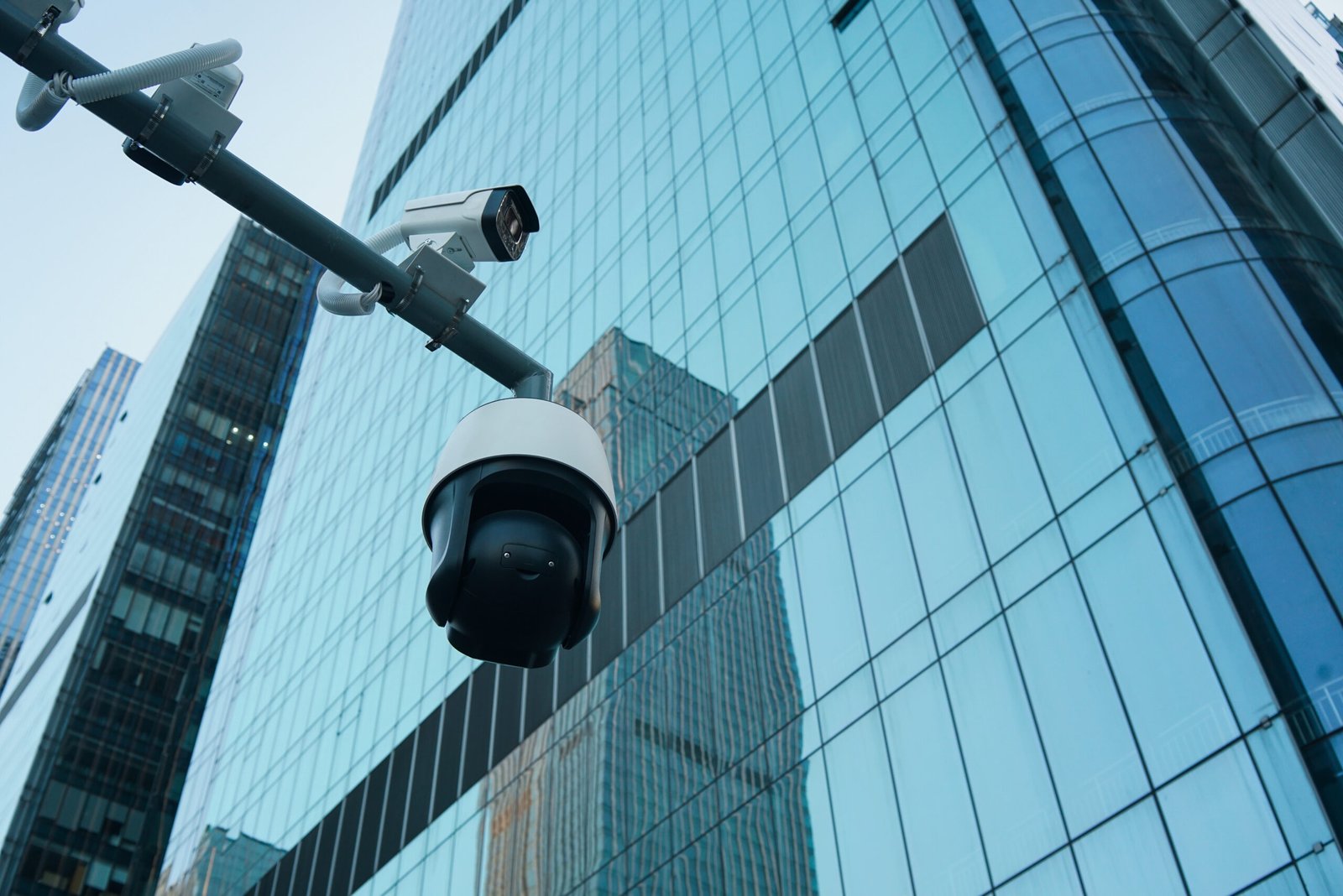 CCTV Camera Installation Melbourne 5 security cameras against modern glass skyscraper 2026 09 23 11 00 35 utc scaled