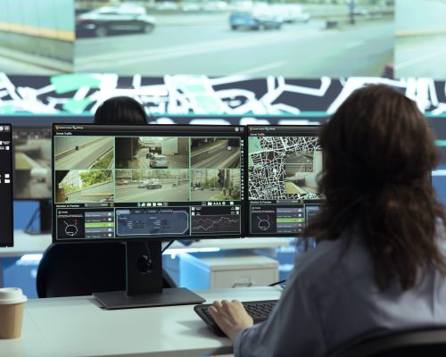 Call center employee providing shipment information via gps satellite navigation for their clients, ensuring fast delivery and order tracking service. Operator monitoring traffic for the couriers.